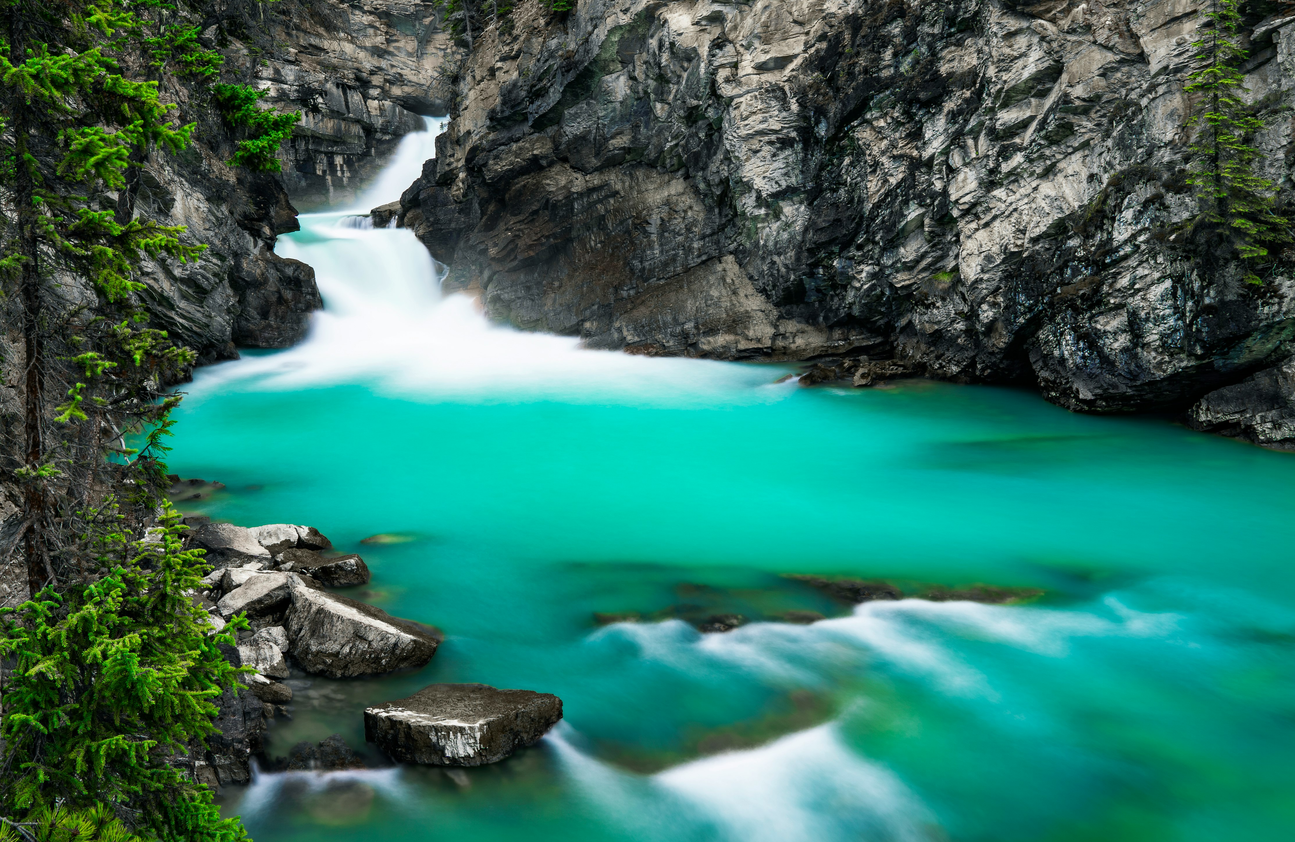 rocky mountain with water falls